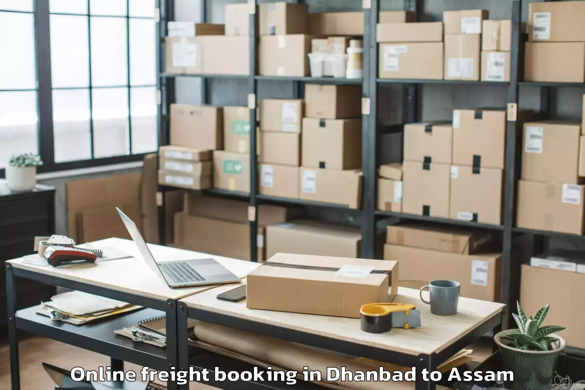 Trusted Dhanbad to Basugaon Online Freight Booking